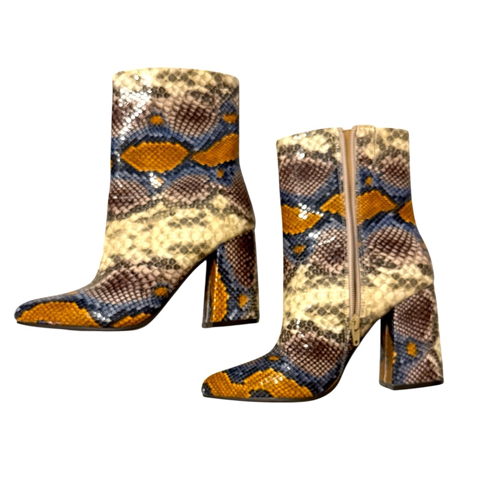 The Limited Snakeskin design boots size 7